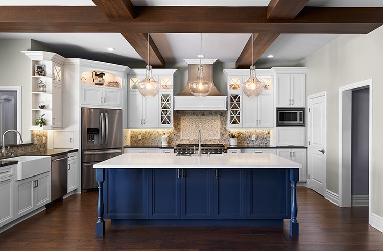 Kitchen remodel with white cabinetry, navy blue island and wood beam ceiling — La Crescenta