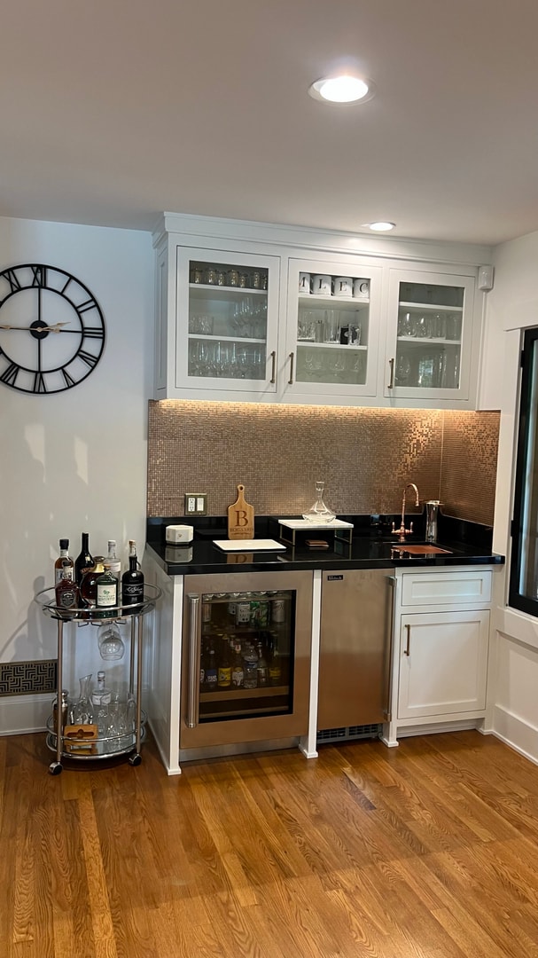 Custom wet bar with white cabinetry and rose gold mosaic backsplash — South Pasadena